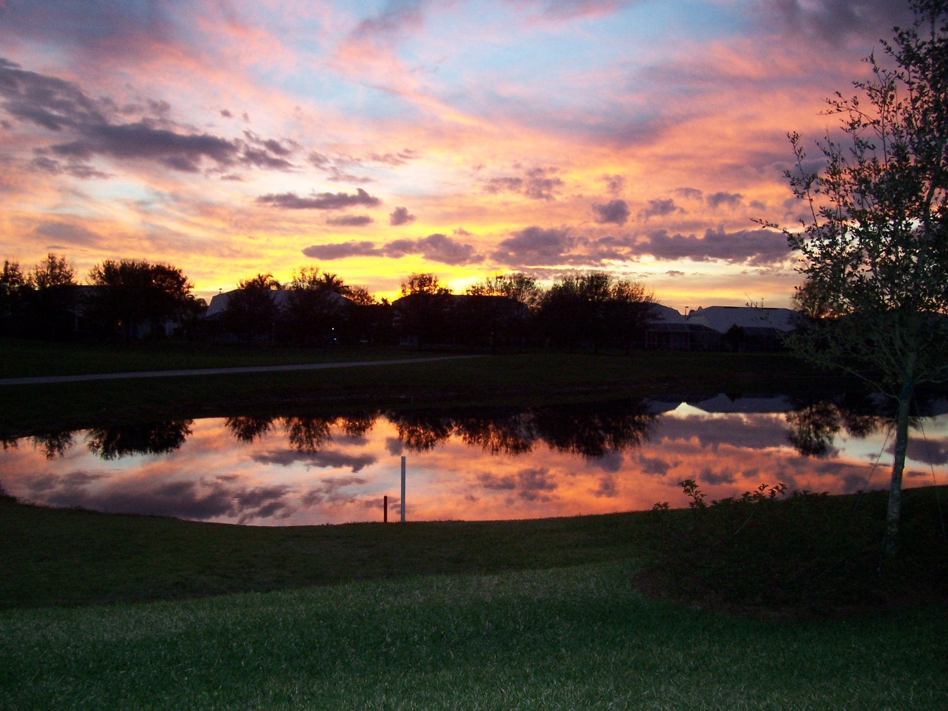 Sunset over Continental Country Club community pond in Wildwood Florida